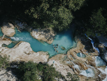 High angle view of rocks by river