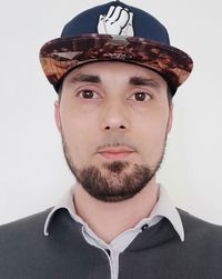 Portrait of young man against white background