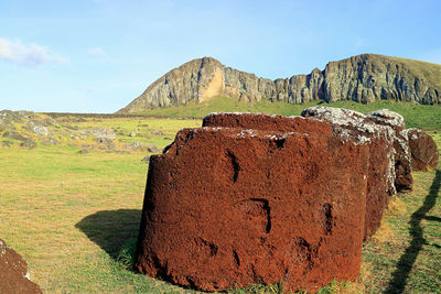 Topknots or hats of moai statues made from red scoria at ahu tongariki, easter island, chile