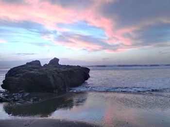 Scenic view of sea at sunset