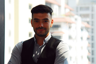 Portrait of young man standing outdoors