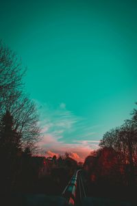 Silhouette trees against sky during sunset