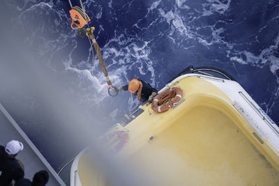 High angle view of man in boat at sea