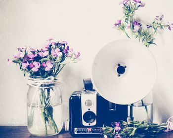 Flower vase on table