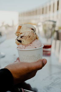 Hand holding ice cream cone