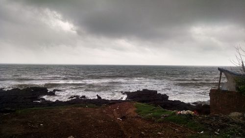 Scenic view of sea against cloudy sky