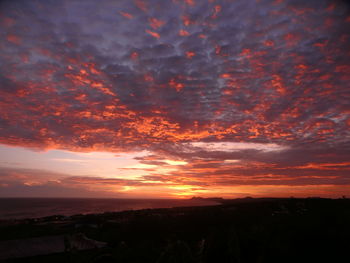 Scenic view of dramatic sky during sunset