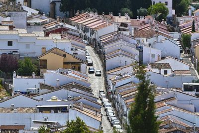 High angle view of street amidst houses in town