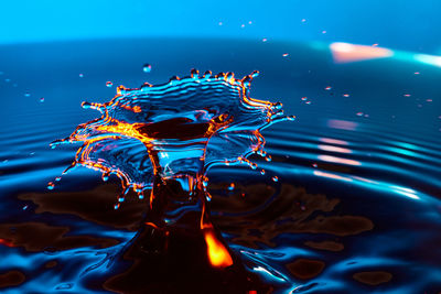 High angle view of drop falling on water