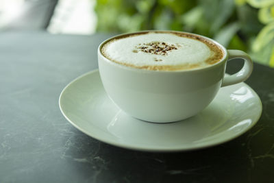 Close-up of cappuccino on table