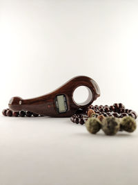 Close-up of objects on table against white background