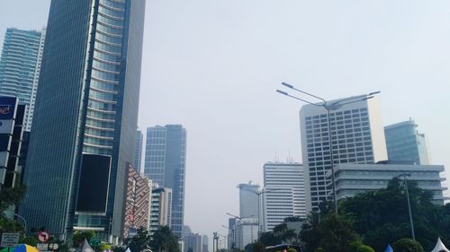 Low angle view of modern buildings against sky