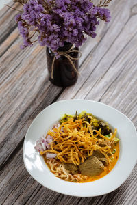 High angle view of flowers in bowl on table