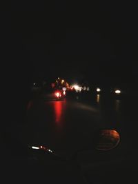 Illuminated car on road at night