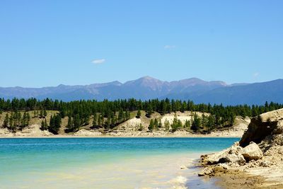 Scenic view of mountains against clear blue sky