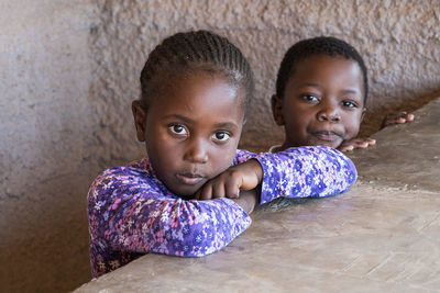 Portrait of girl with brother