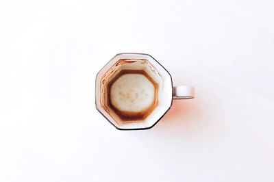 High angle view of coffee on table against white background