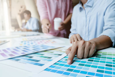 Close-up of hands on table
