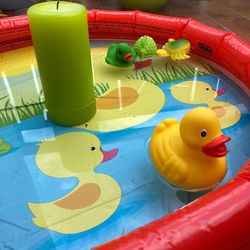 High angle view of toys in plastic floating on water