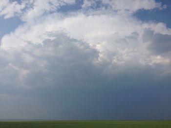 Scenic view of landscape against cloudy sky