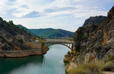 Bridge over river against sky