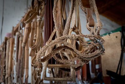 Close-up of rope tied up on wood