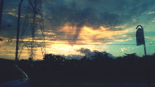 Silhouette trees against sky during sunset