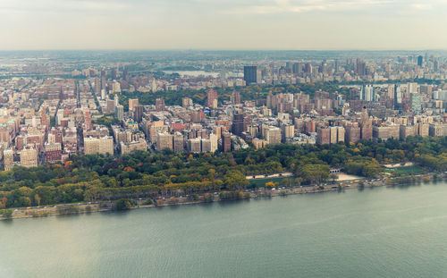 High angle view of river amidst buildings in city