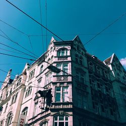 Low angle view of building against blue sky