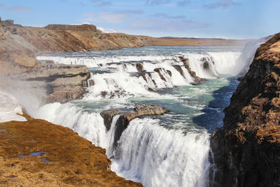 Scenic view of gullfoss falls against sky