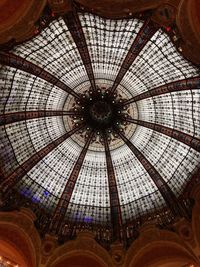 Low angle view of chandelier hanging from ceiling