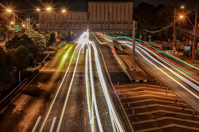 High angle view of light trails on road at night