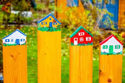 Houses drawn on wooden fence