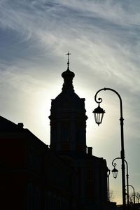 Low angle view of building against cloudy sky