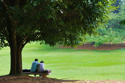 Rear view of man relaxing in park