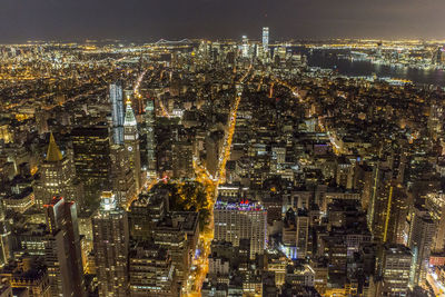 Aerial view of illuminated cityscape at night