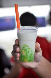 Close-up of hand holding drink