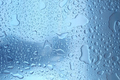 Full frame shot of wet glass window