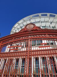 Low angle view of building against blue sky