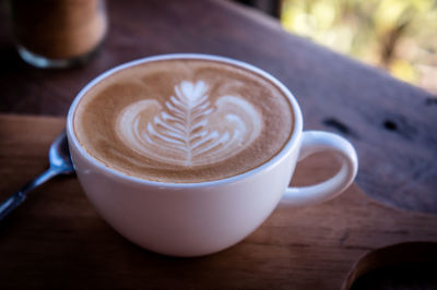 Close-up of cappuccino on table