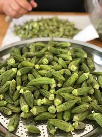 High angle view of okras in container on table