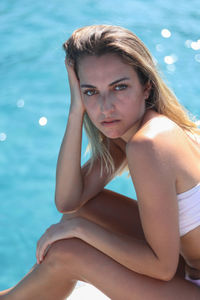 Portrait of woman on luxury yacht deck on summer vacation trip in menorca