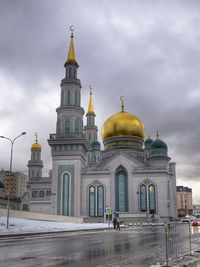 Building exterior against cloudy sky