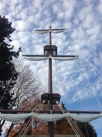 Low angle view of amusement park ride against sky