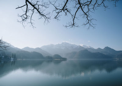 Scenic view of lake with mountain range in background