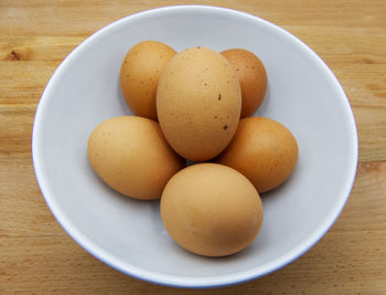 High angle view of eggs in plate on table