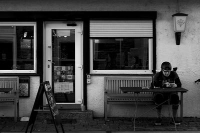 Man sitting on chair in building