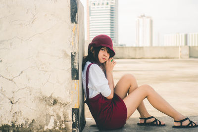 Portrait of woman sitting outdoors