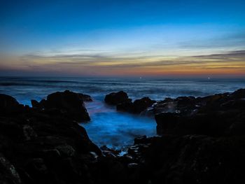 Scenic view of sea against sky during sunset