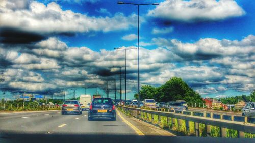 View of road against cloudy sky